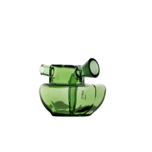 The MJ Arsenal Commander Blunt Bubbler features modern, transparent green borosilicate glass with a rounded base and short, angled cylindrical spout, shown against a plain white background.