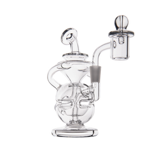 The MJ Arsenal Infinity Mini Dab Rig is a clear borosilicate glass rig with an intricate design, rounded base, curved neck, and side banger, shown against a plain white background.