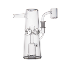 The MJ Arsenal Turret Mini Dab Rig is a portable clear borosilicate glass rig with a flared base, central percolator, curved mouthpiece, and quartz banger—shown on a plain white background.