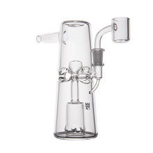 The MJ Arsenal Turret Mini Dab Rig features clear borosilicate glass, a cylindrical base, detailed inner chamber, curved side mouthpiece, and angled bowl—sleek and portable, shown on a white background.