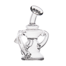 The MJ Arsenal Hydra Vape Edition is a clear glass mini dab rig with an intricate, artistic design of swirling and looping tubes, pictured against a plain white background.