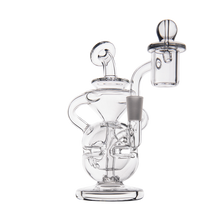 The MJ Arsenal Infinity Mini Dab Rig is crafted from clear borosilicate glass, featuring intricate curving tubes, a rounded chamber, and an attached banger for dabbing, all showcased against a plain white background.
