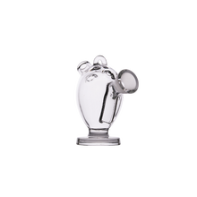 The MJ Arsenal The Martian® Original Blunt Bubbler™ is a clear glass piece shaped like a pig, featuring water filtration and playful style—perfect for upgrading your smoking sessions. Photographed on a plain white background.