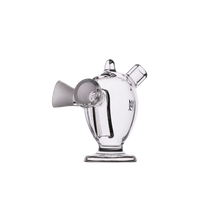 The MJ Arsenal Dubbler Original Double Bubbler is a compact, clear borosilicate glass piece featuring a round body, angled mouthpiece, upright opening, and stable base, shown against a white background.