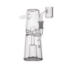 The MJ Arsenal Turret Mini Dab Rig features clear borosilicate glass, a cylindrical base, decorative midsection accents, a protruding mouthpiece, and an angled side bowl; this portable piece is shown on a white background.