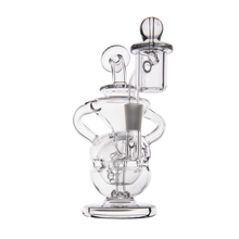 The MJ Arsenal Infinity Mini Dab Rig is a clear borosilicate glass rig with intricate curves, a round base, cylindrical chamber, fab egg percolator, and removable bowl piece, shown on a plain white background.
