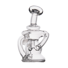 The MJ Arsenal Hydra Vape Edition is a clear glass mini dab rig with a unique, artistic design of curved and twisted sections, displayed against a plain white background.