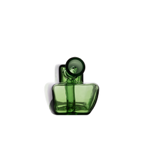 The MJ Arsenal Commander Blunt Bubbler features a modern design with a green borosilicate glass rectangular body and a round, tilted neck, showcased against a plain white background.