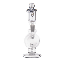 The MJ Arsenal Atlas Mini Dab Rig is a clear borosilicate glass piece with a round base, cylindrical neck, and intricate honeycomb percolator at the top, shown against a white background.
