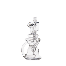 The MJ Arsenal Hydra Mini Dab Rig is a clear glass water pipe with an artistic multi-chamber design and curved handle, resembling a Klein recycler dab rig, shown against a plain white background.