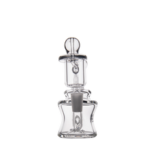 The MJ Arsenal Jammer Mini Dab Rig, made from borosilicate glass with a rounded stopper, features curved and angular shapes for a modern, artistic look—displayed on a plain white background.