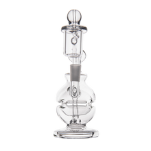 The MJ Arsenal Royale Mini Dab Rig is a clear borosilicate glass water pipe with an intricate fab egg-style round chamber, straight neck, and detachable bowl, shown on a plain white background.