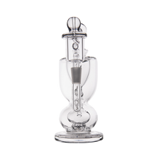 The MJ Arsenal Titan Mini Dab Rig is a clear borosilicate glass piece featuring a rounded base, vertical chamber, removable downstem, and dome-shaped mouthpiece, shown against a plain white background.