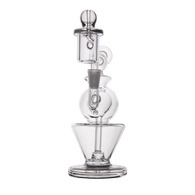 The MJ Arsenal Gemini Mini Dab Rig is a clear borosilicate glass water pipe with a cylindrical mouthpiece, round chamber, and wide cone-shaped base, shown against a white background.