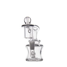 The MJ Arsenal Jammer Mini Dab Rig is a clear borosilicate glass piece with cylindrical and curved sections, a central rubber stopper, and an attached tube, photographed against a plain white background.