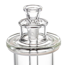 Close-up of the MJ Arsenal Piston Gravity Bong, crafted from clear borosilicate glass with a cylindrical neck, round base, frosted stopper, and smooth reflective finish.