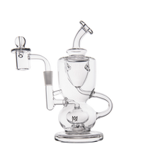 The MJ Arsenal Titan Mini Dab Rig, made of clear borosilicate glass with multiple chambers, curved tubes, a side handle, and domed mouthpiece, is shown against a plain white background.
