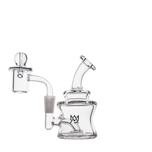 The MJ Arsenal Jammer Mini Dab Rig is a clear borosilicate glass water pipe with a tilted mouthpiece, cylindrical chamber, detachable dome, and small crown logo on the base, shown against a plain white background.