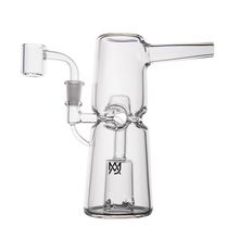 The MJ Arsenal Turret Mini Dab Rig is a portable borosilicate glass rig featuring a cylindrical base, angled mouthpiece, side arm for a quartz banger, visible diffuser, and a small black logo on its base.