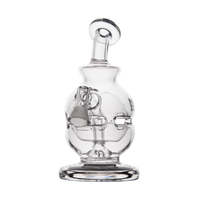 The MJ Arsenal Royale Vape Edition, a clear glass water pipe with a round base, bent neck, and side bowl or nail attachment, is shown on a plain white background—perfect for pairing with your favorite accessories.