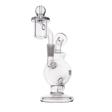 The MJ Arsenal Atlas Mini Dab Rig is a clear borosilicate glass rig with a round base, angled neck, and attached bowl, designed for smoking concentrates. Its compact size and smooth, transparent curves give it a sleek, modern style.