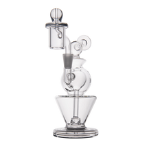 The MJ Arsenal Gemini Mini Dab Rig, made of clear borosilicate glass with a rounded chamber, wide base, and multiple curved components, is shown on a plain white background.