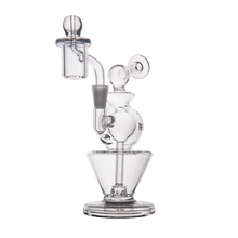 The MJ Arsenal Gemini Mini Dab Rig, crafted from clear borosilicate glass with a unique multi-chamber design, curved neck, and round base, sits on a white background—perfect for smooth, portable dab sessions anywhere.