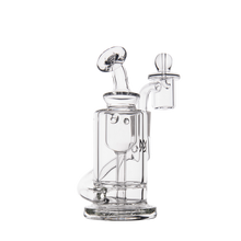 The MJ Arsenal Ursa Mini Dab Rig, made from clear borosilicate glass, features a cylindrical body, curved mouthpiece, and dome percolator, shown against a plain white background.