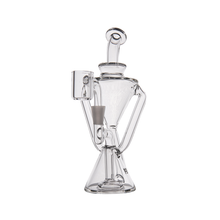 The MJ Arsenal Time Turner Mini Dab Rig, made of clear borosilicate glass with a conical base, curved arms, and a cylindrical mouthpiece, is displayed on a white background.