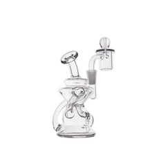 The MJ Arsenal Hydra Mini Dab Rig features clear glass, a curved neck, circular base, intricate percolator design, and comes with an attached quartz banger and carb cap, shown on a plain white background.