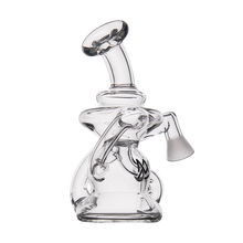 The MJ Arsenal Hydra Vape Edition is a clear glass mini dab rig water pipe with a curved mouthpiece, fixed downstem, side chamber, and splash-resistant bubbler design featuring smooth, rounded edges and an intricate structure on a white background.