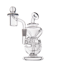 The MJ Arsenal Infinity Mini Dab Rig is a clear borosilicate glass piece with intricate curves, twisted components, a removable bowl, and a rounded base, photographed against a plain white background.