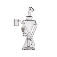 The MJ Arsenal Time Turner Mini Dab Rig is a clear borosilicate glass water pipe featuring a geometric hourglass base, angled mouthpiece, and side attachment for accessories, shown against a white background.