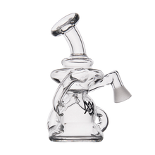 The MJ Arsenal Hydra Vape Edition is a clear glass mini dab rig featuring a curved neck, wide base, and angled side mouthpiece. This splash-resistant bubbler is perfect for smoking or vaporizing your favorite substances.