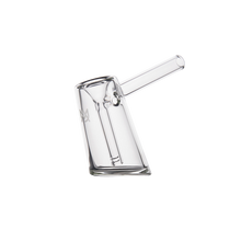 The MJ Arsenal Fulcrum Bubbler features a clear, angled cylindrical body with a straight side mouthpiece, crafted from durable borosilicate glass and shown on a plain white background.