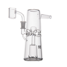 The MJ Arsenal Turret Mini Dab Rig, crafted from borosilicate glass with detailed center glasswork, a side mouthpiece, and left bowl attachment, stands upright on a white background—ideal for portability.