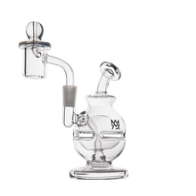 The MJ Arsenal Royale Mini Dab Rig features clear borosilicate glass, round base, fab egg percolator, angled neck, attached bowl, spherical carb cap, and a logo on the body. Pictured against a plain white background.