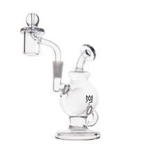 The MJ Arsenal Atlas Mini Dab Rig is a clear borosilicate glass rig with a spherical chamber, side mouthpiece, loop handle, attached banger, compact design, and features an overlapping black Ms logo on the front.