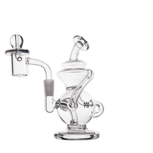 The MJ Arsenal Mini Jig Mini Dab Rig features a clear glass design with a round base, angled neck, side quartz banger, and curved tubes. Shown against a white background, this elegant rig offers recycler function for smooth dabs.