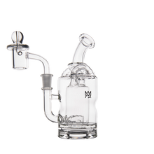 The MJ Arsenal Turbine Mini Dab Rig is a clear borosilicate glass rig with a curved sidecar mouthpiece, cylindrical base, Inception Turbine Perc, attached glass bowl, small logo on the chamber, and photographed on a white background.