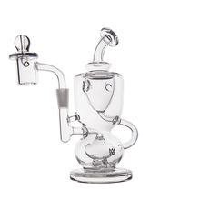 The MJ Arsenal Titan Mini Dab Rig, made of clear borosilicate glass, features a rounded base, curved mouthpiece, and attached banger for concentrates, shown on a white background.