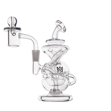 The MJ Arsenal Infinity Mini Dab Rig is a clear borosilicate glass water pipe featuring intricate swirling designs, a round base, and a side-mounted chamber, displayed against a white background.