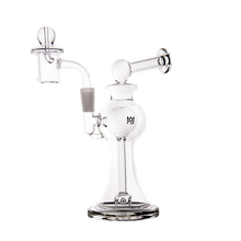The MJ Arsenal Apollo Mini Dab Rig is a clear borosilicate glass piece with a round base, angled mouthpiece, bowl attachment, and the MJ Arsenal logo on the chamber, designed for optimal vapor cooling against a white background.