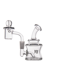 The MJ Arsenal Jammer Mini Dab Rig is a clear borosilicate glass rig with a bent neck, round chamber, side percolator attachment, dome-shaped cover, and a black stylized M logo on the main chamber.