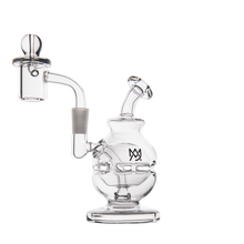 The MJ Arsenal Royale Mini Dab Rig is crafted from durable borosilicate glass with a round base, angled mouthpiece, side fab egg percolator, attached domed banger, and features a subtle MV logo on the front.
