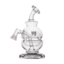 The MJ Arsenal Royale Vape Edition features a clear glass body, angled mouthpiece, and side joint. Its circular base ensures stability, while the front displays the overlapping M logo—ideal as a dab rig for smooth vaping sessions.