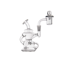 The MJ Arsenal Hydra Mini Dab Rig is a clear glass mini dab rig featuring a bent neck, circular base, side handle, and attached banger with carb cap. Spill-resistant, it delivers smooth hits in a compact design. Set against a plain white background.