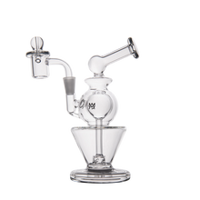 The MJ Arsenal Gemini Mini Dab Rig is a clear borosilicate glass dab rig with a round chamber, angled mouthpiece, flat base, quartz banger, and logo on the central sphere. Its modern design is shown on a white background.