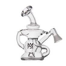 The MJ Arsenal Hydra Vape Edition is a clear glass mini dab rig with a unique twisting design, angled mouthpiece, and MJ logo on the base. It functions as a splash-resistant bubbler and is shown against a plain white background.