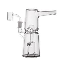 The MJ Arsenal Turret Mini Dab Rig is a clear borosilicate glass dab rig with a cylindrical base, angled mouthpiece, side chamber, minimalist scientific design, and a small logo near the base.